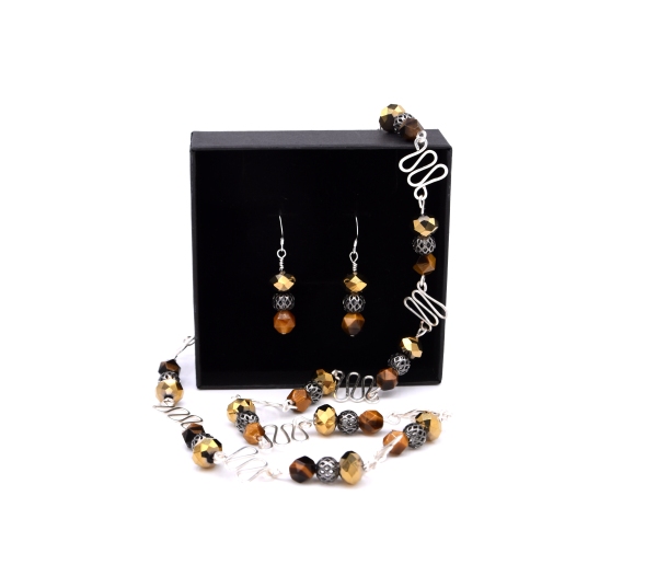 Gabriella Szekely jewellery - filigree and glass bead pendant and earing as a set displayed in a jewellery box - silver beads golden glass bead and tiger eye brown orange beads with handmade findings